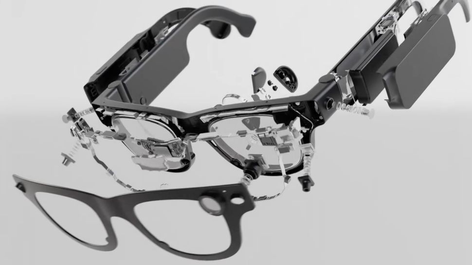 Tiêu đề: Kính thông minh Meta Aria Gen 2: Bước tiến vượt bậc so với Ray-Ban Meta - Still from a promotional video about Meta Project Aria Gen 2, showing the various smart glasses components broken out in virtual space